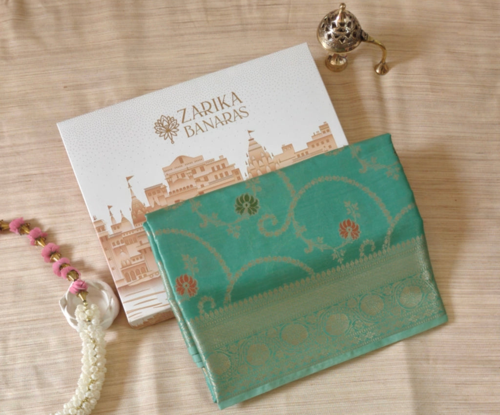 Elegant sea green Shimmer Tissue Saree with Meenakari Floral Work