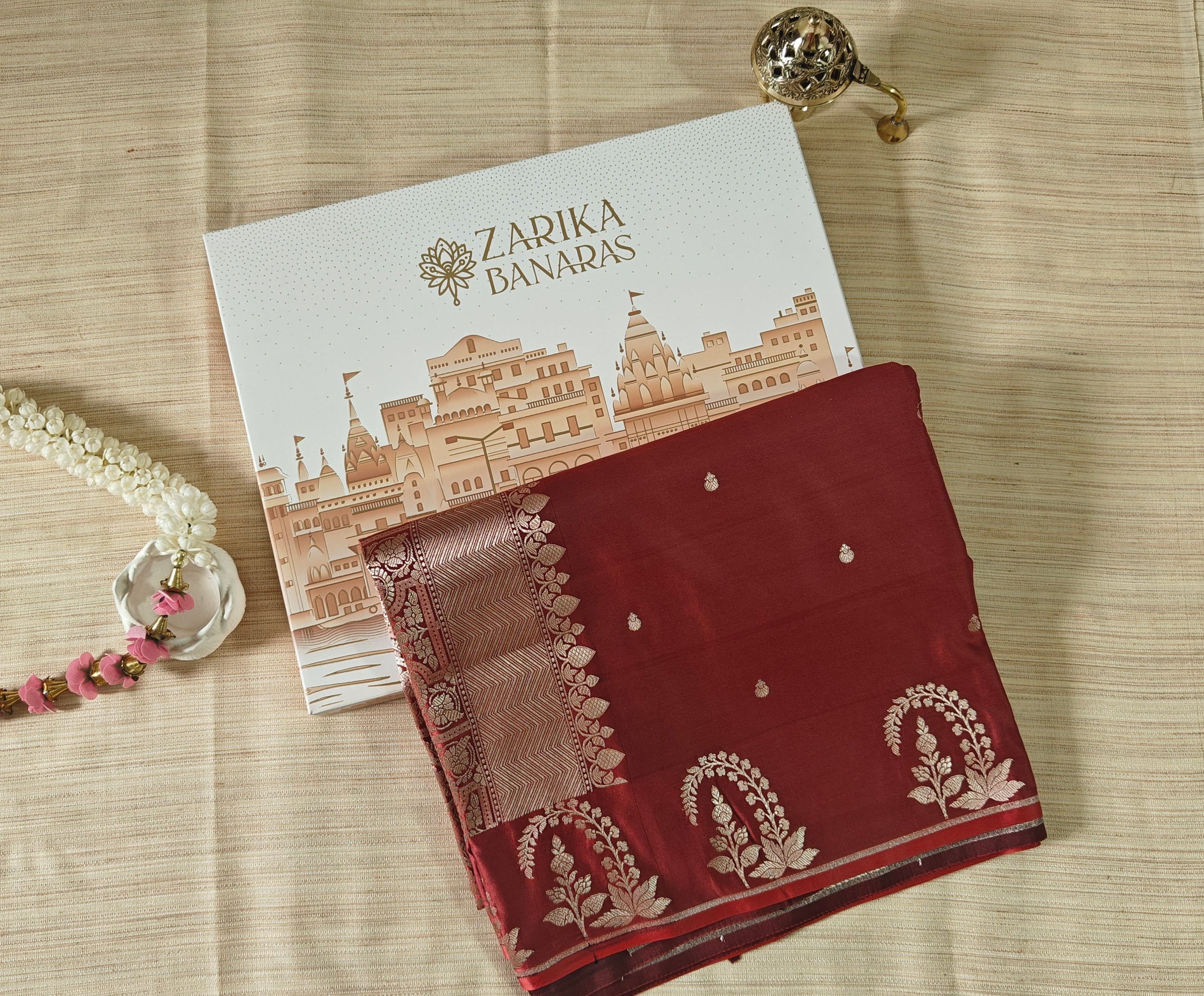 Rust Silk Saree with small zari Booti & Statement Border