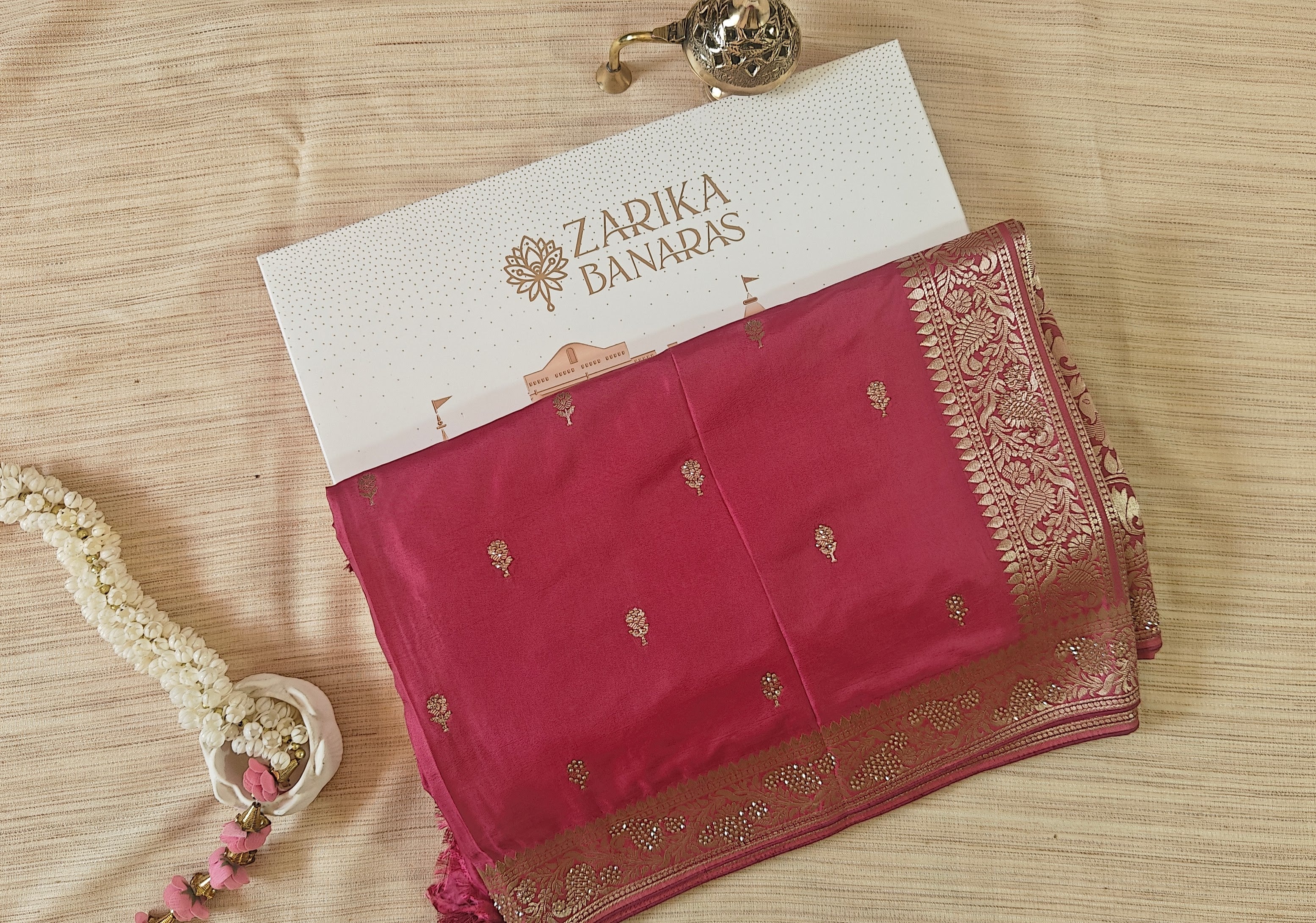 Designer Saree in Soft Butter Crepe with Elegant Drape & Rich Swarovski detailing