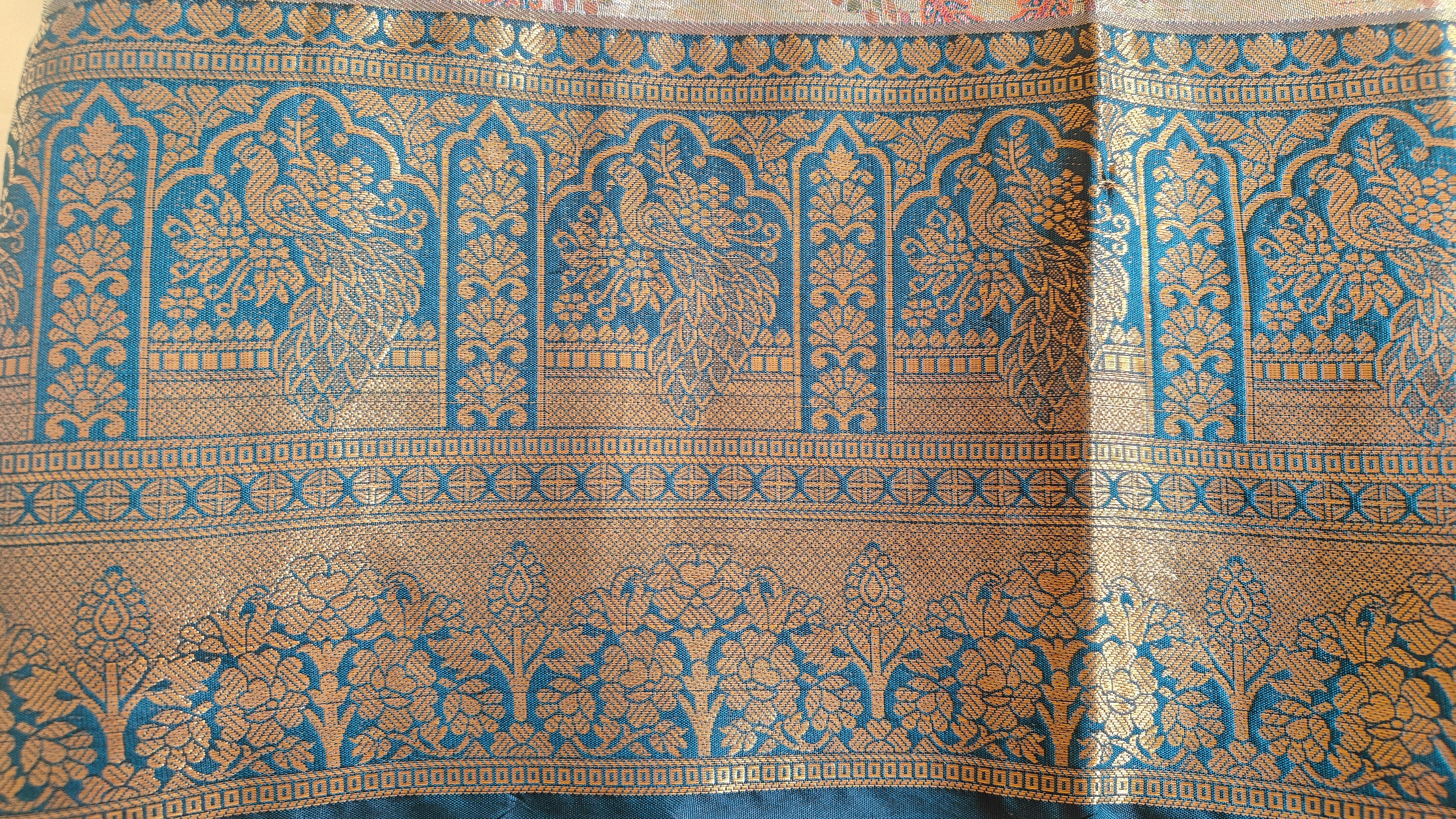 Metallic Golden Tissue Saree with Peacock Motifs & Statement Border