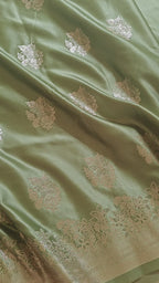 Pastel green Banarasi Silk saree with Floral booti & Stunning Border
